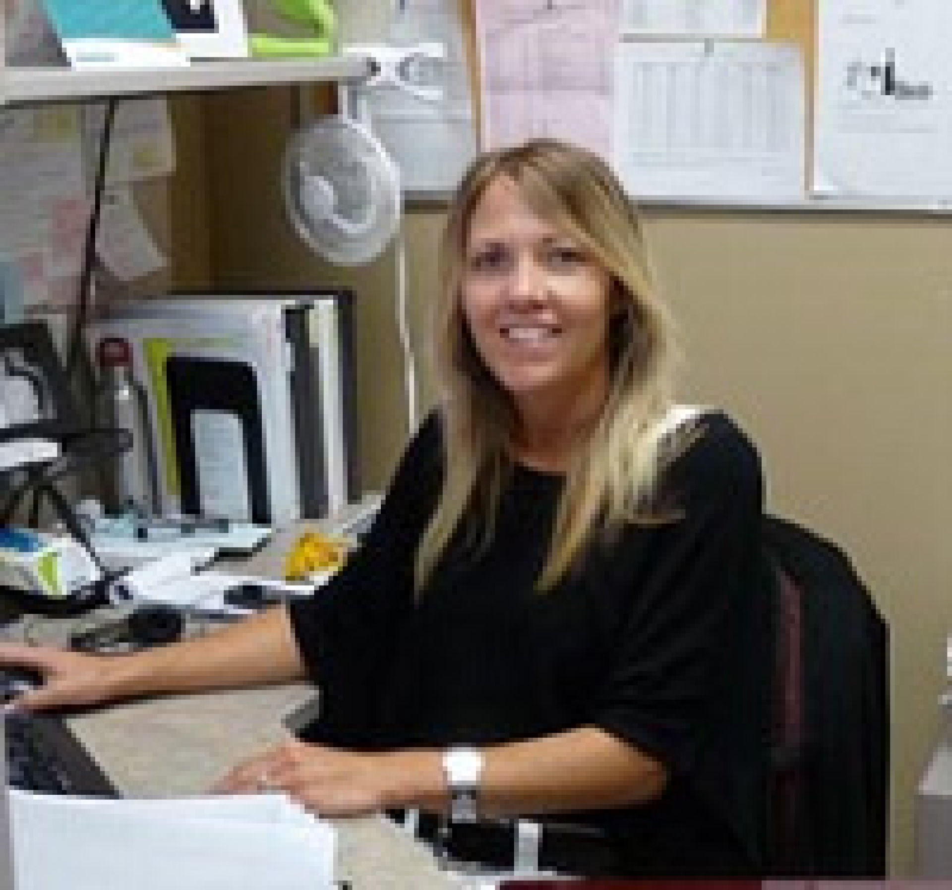 South Country Health Alliance staff member at a computer desk.